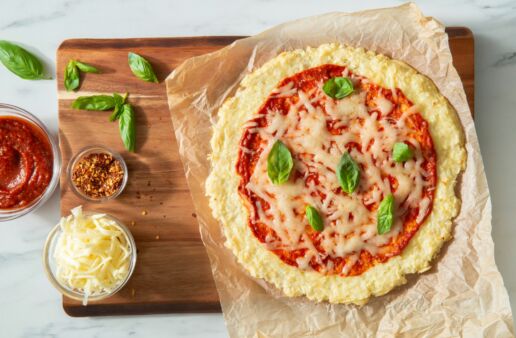 Gluten-Free-rice-crust-pizza-made-with-white-rice-and-topped-with-pizza-sauce-cheese-and-basil